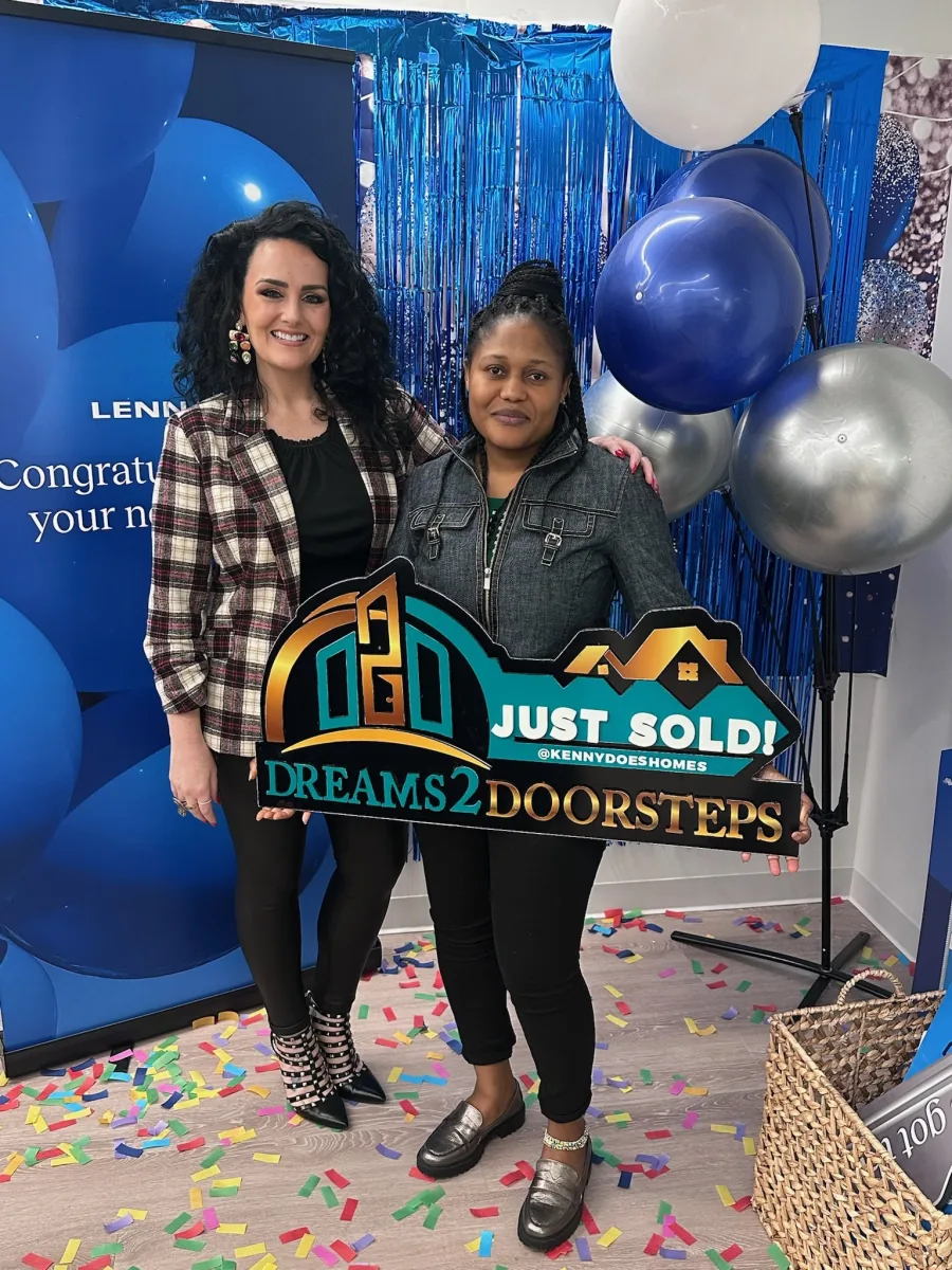 Dreams 2 Doorsteps closing-day celebration with balloons and a Just Sold sign