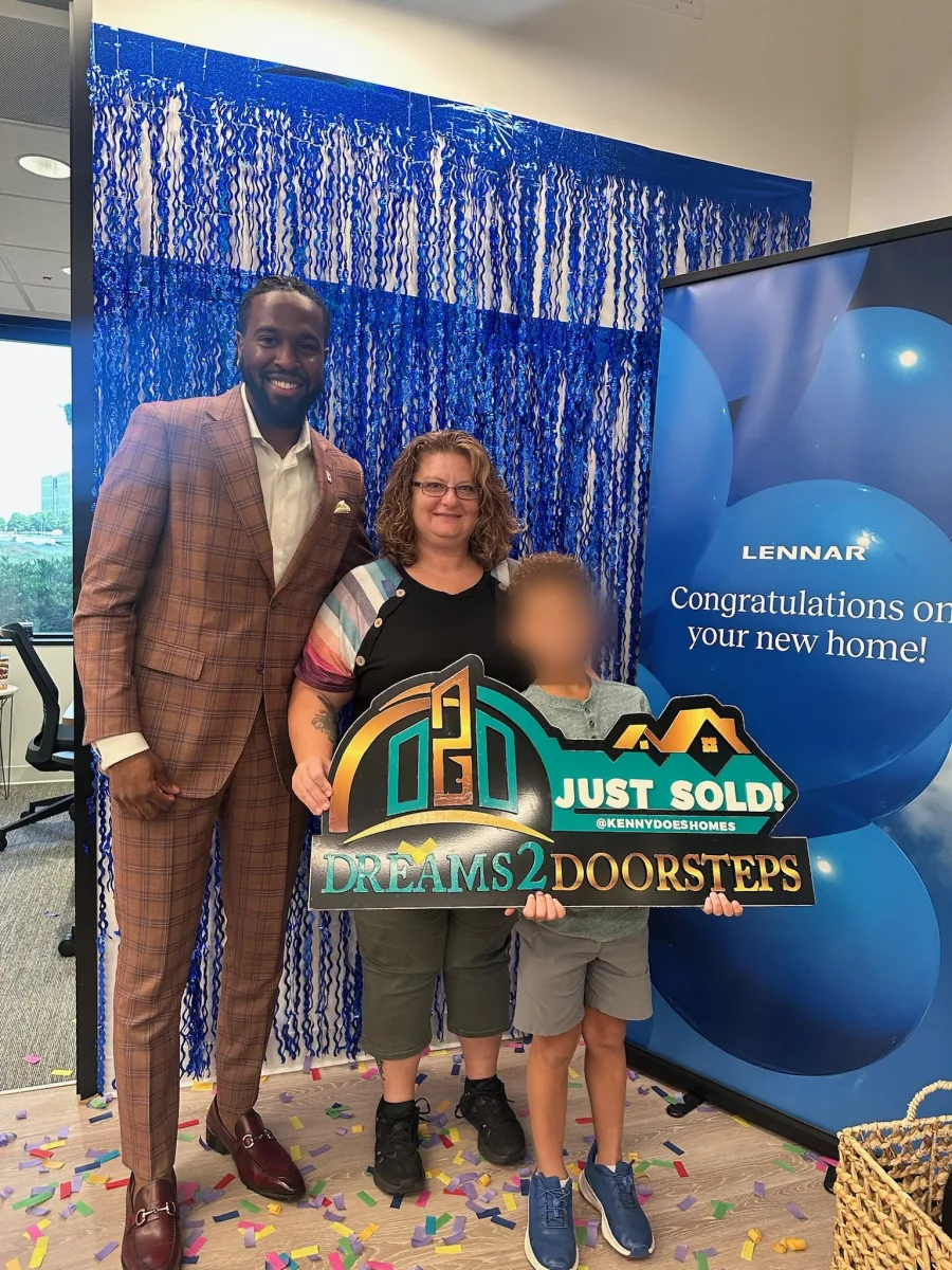 Dreams 2 Doorsteps clients celebrating together outside their new home