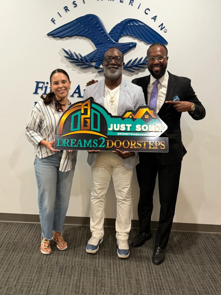 Three people celebrating together after completing a home closing