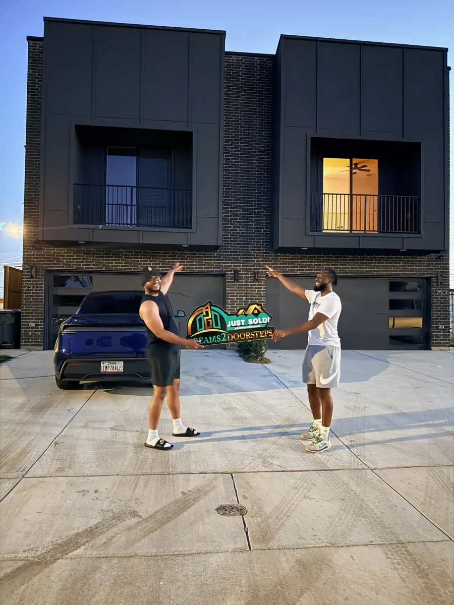 Dreams 2 Doorsteps client celebrating key day outside a townhome